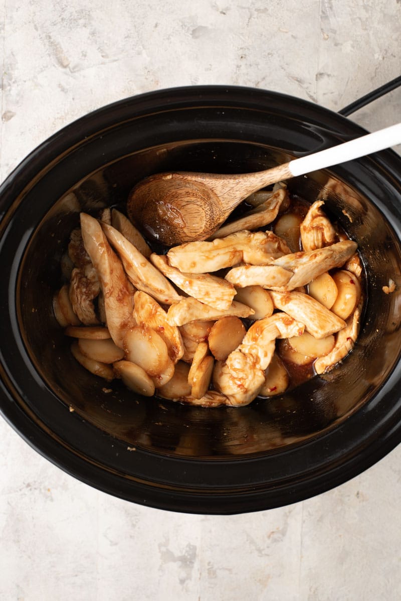 An overhead shot of cashew chicken in a slow cooker