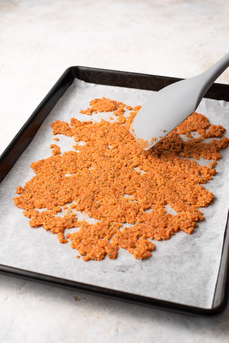 ingredients spread out on a parchment lined cooking sheet