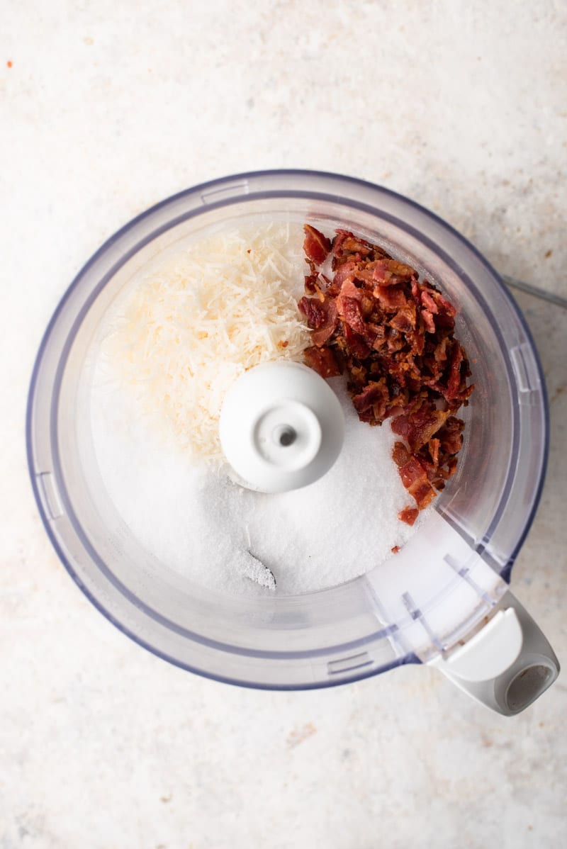 food processor full of different ingredients ready to be blended