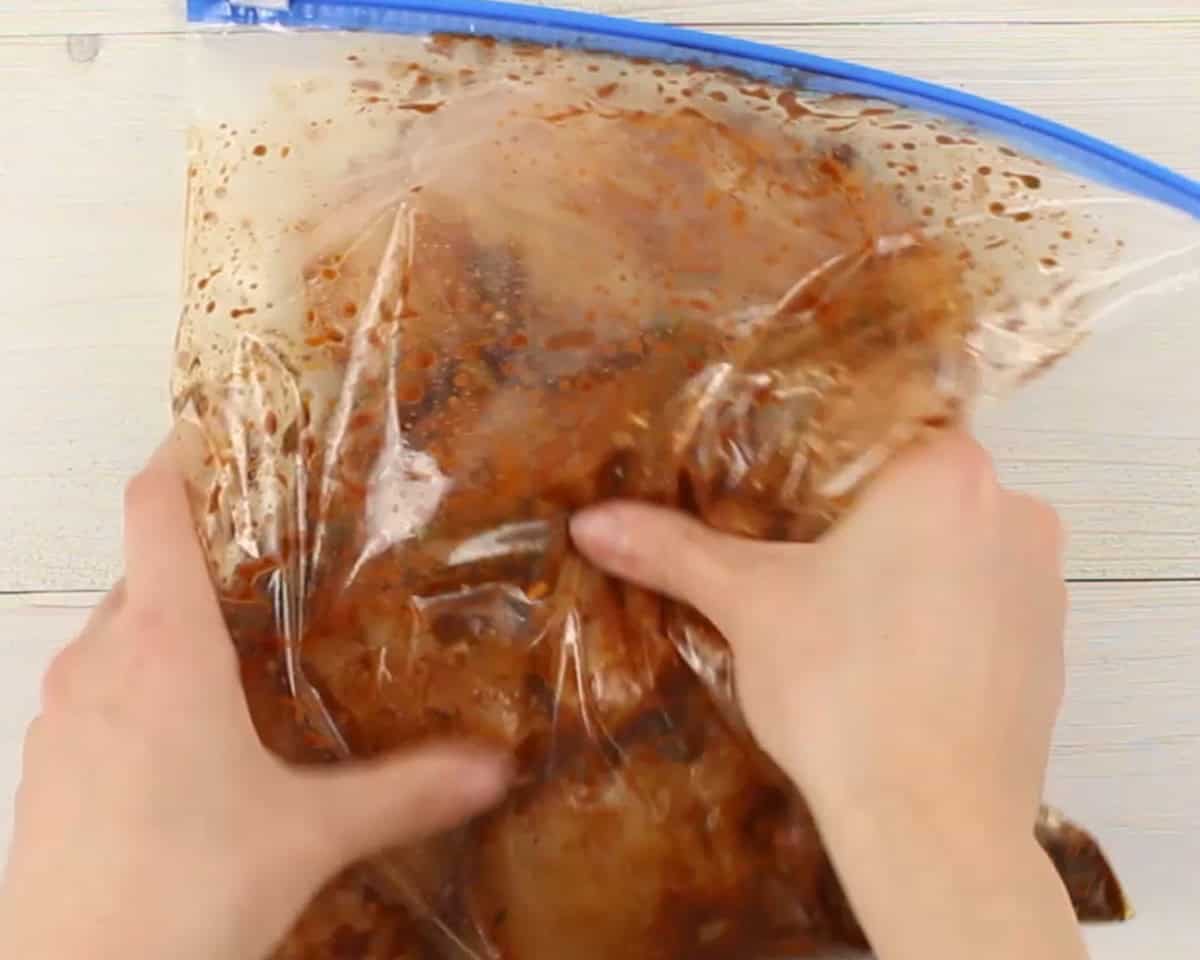 Chicken marinating in a Ziplock bag.