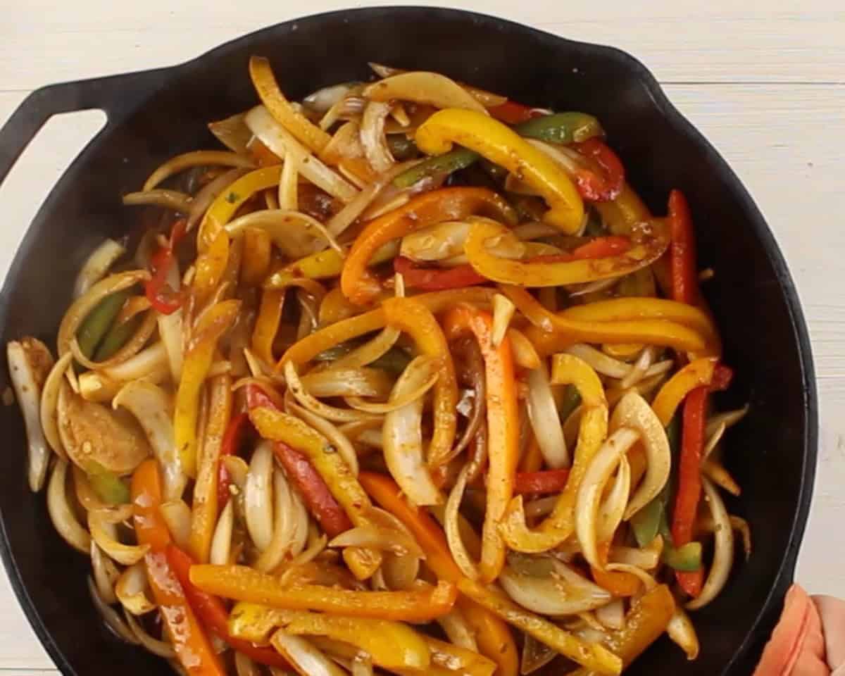 Veggies cooking in a skillet.