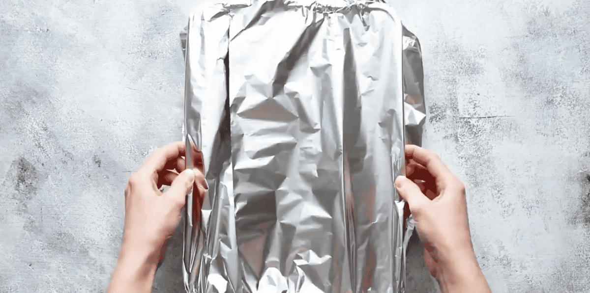 covering the pan with aluminum foil