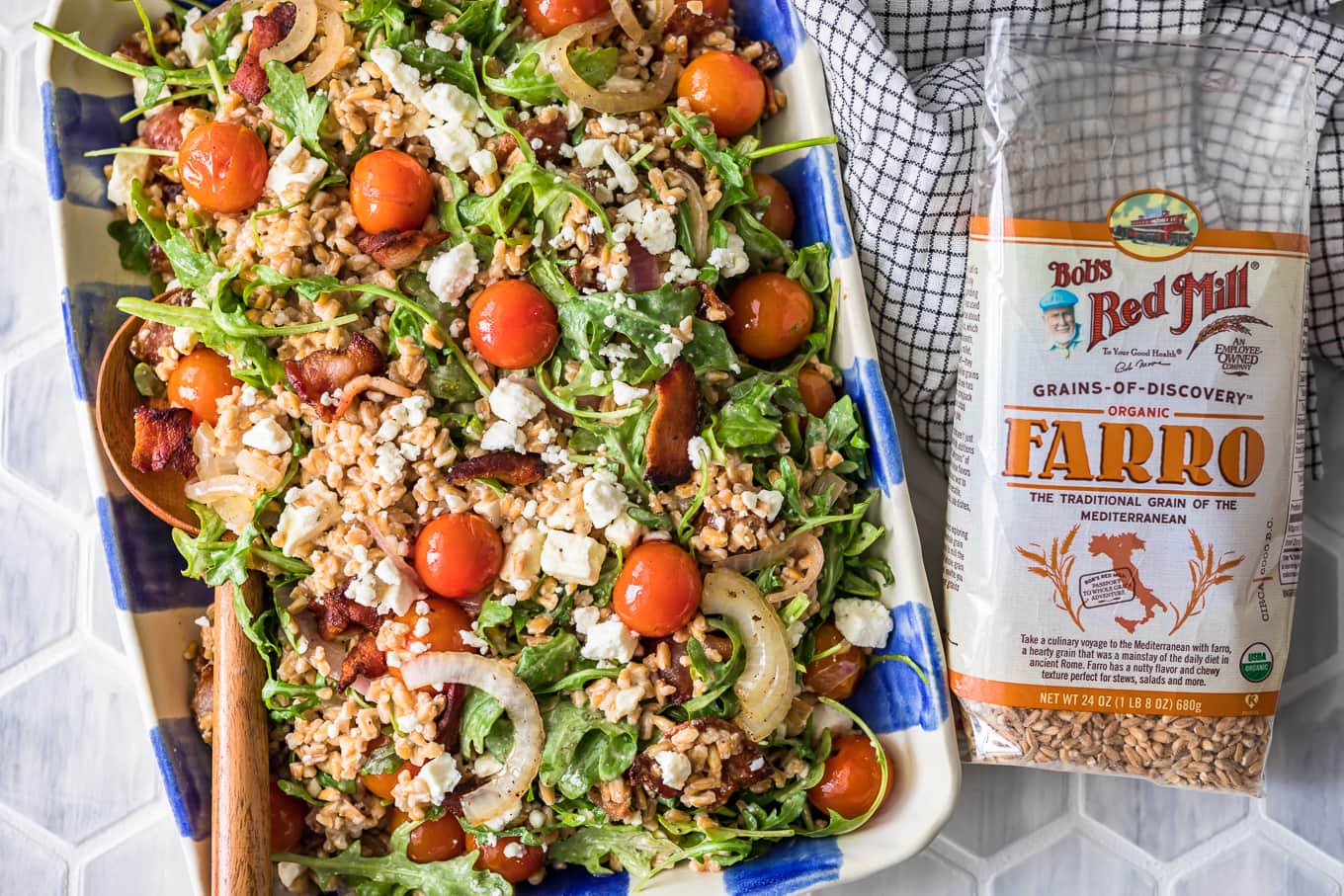 a plate of salad next to a bag of farro