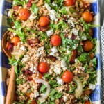 blt farro salad in blue and white checkered serving dish