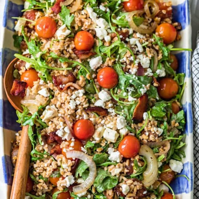 blt farro salad in blue and white checkered serving dish