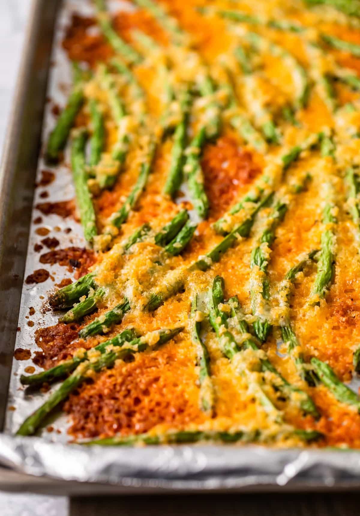 close up of crispy baked green beans in cheese