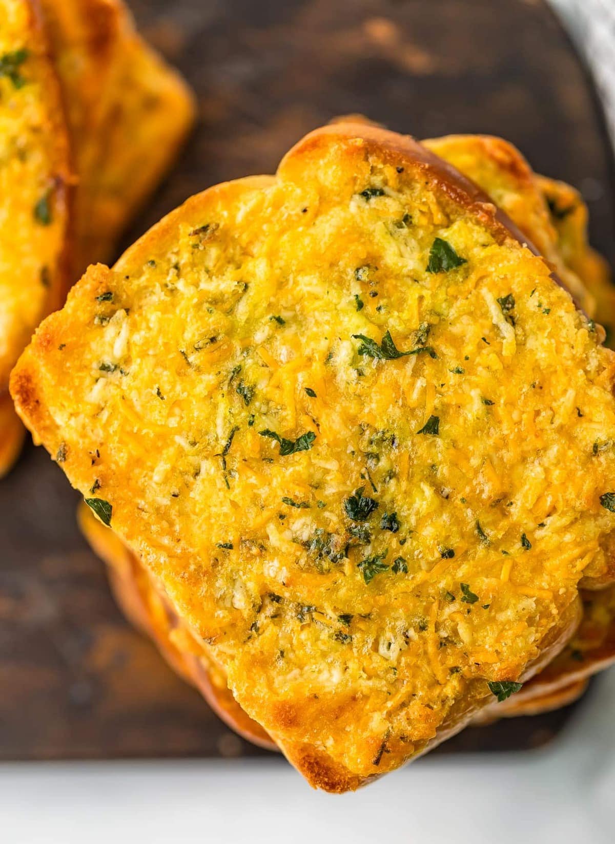 up close picture of cheesy garlic bread on texas toast