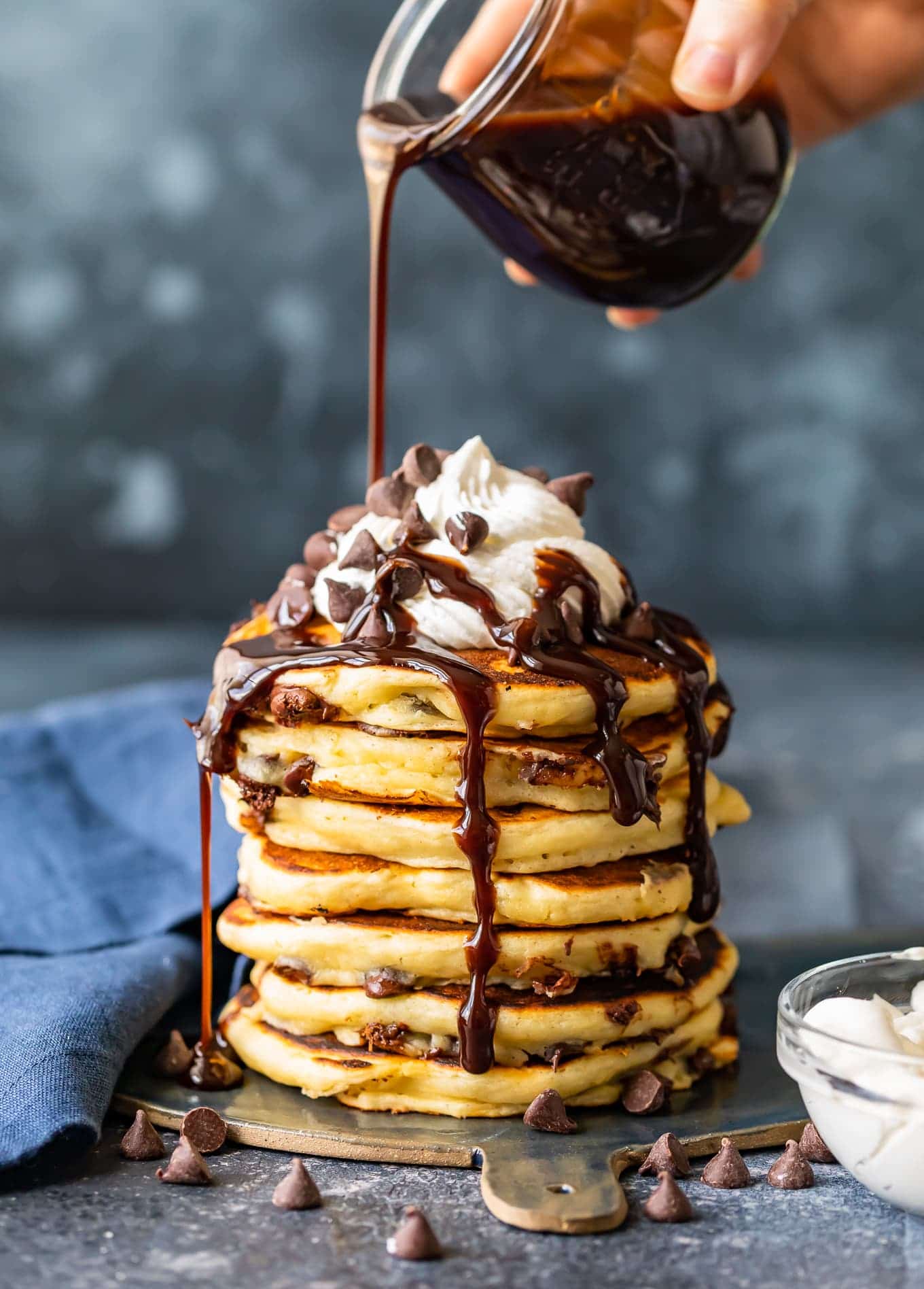Chocolate syrup running down pancakes
