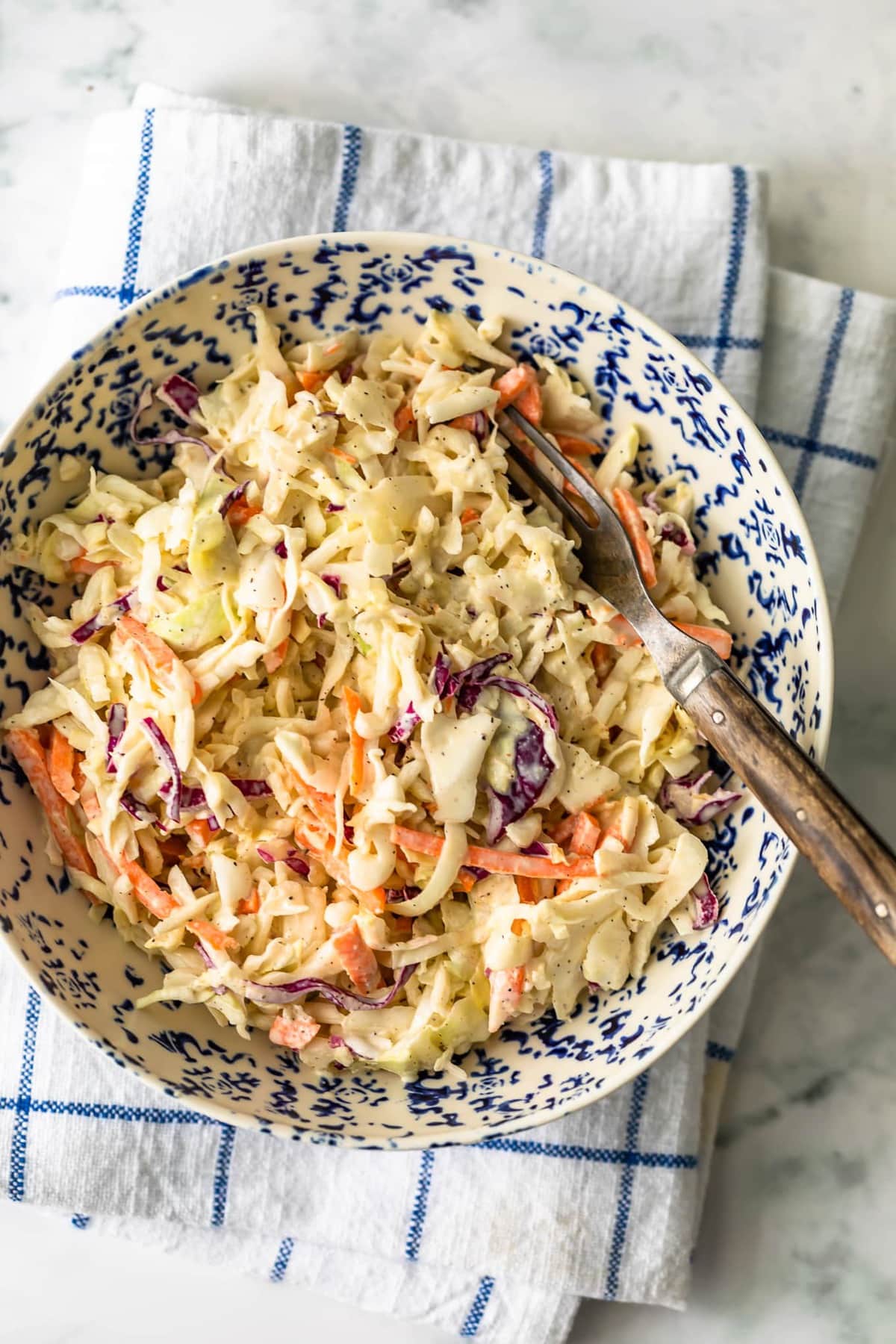 bowl of coleslaw on a dish towel