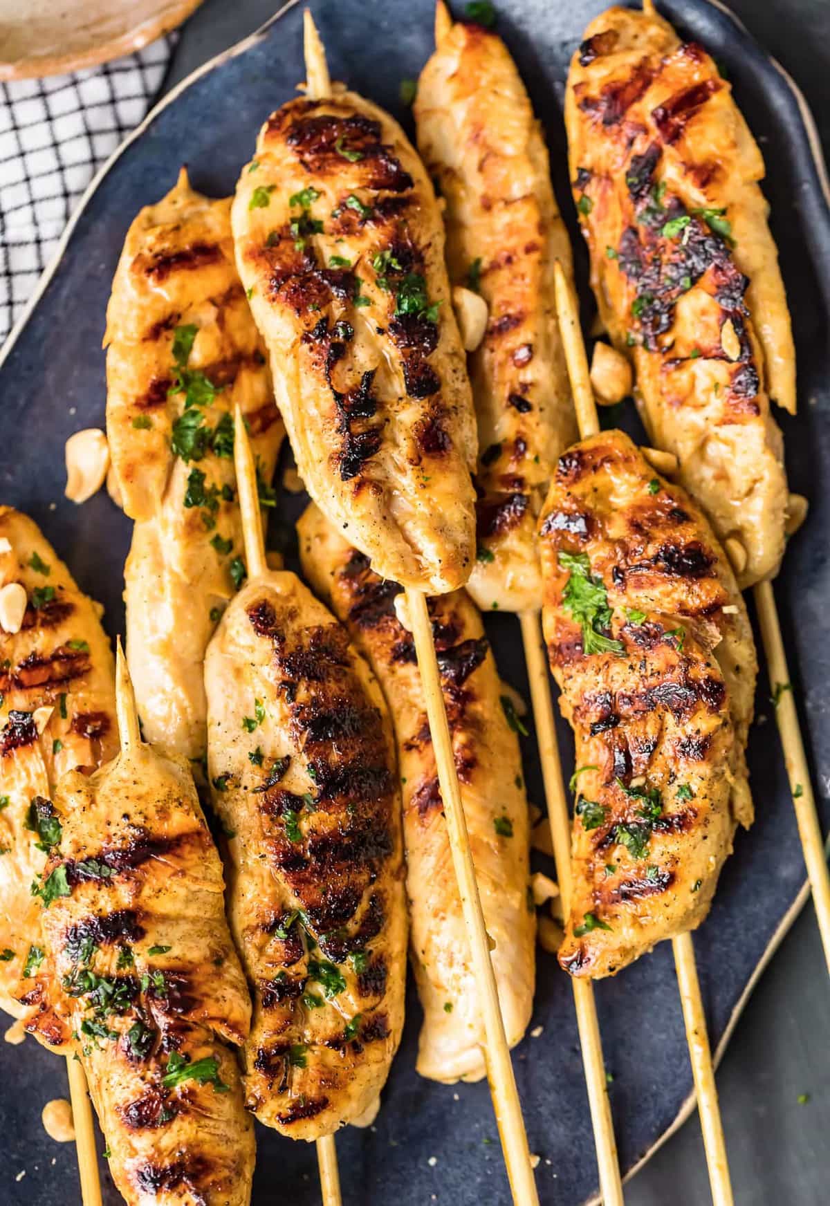 a plate of chicken satay