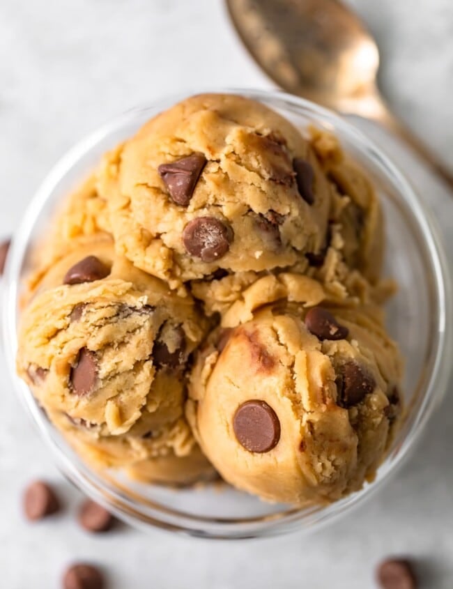 a top view of scooped chocolate chip edible cookie dough in a bowl