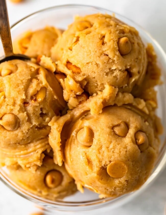 a close up view of edible peanut better cookie dough with peanut butter chips
