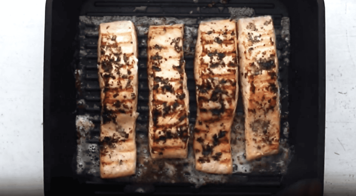 grilled salmon filets in a grill pan.