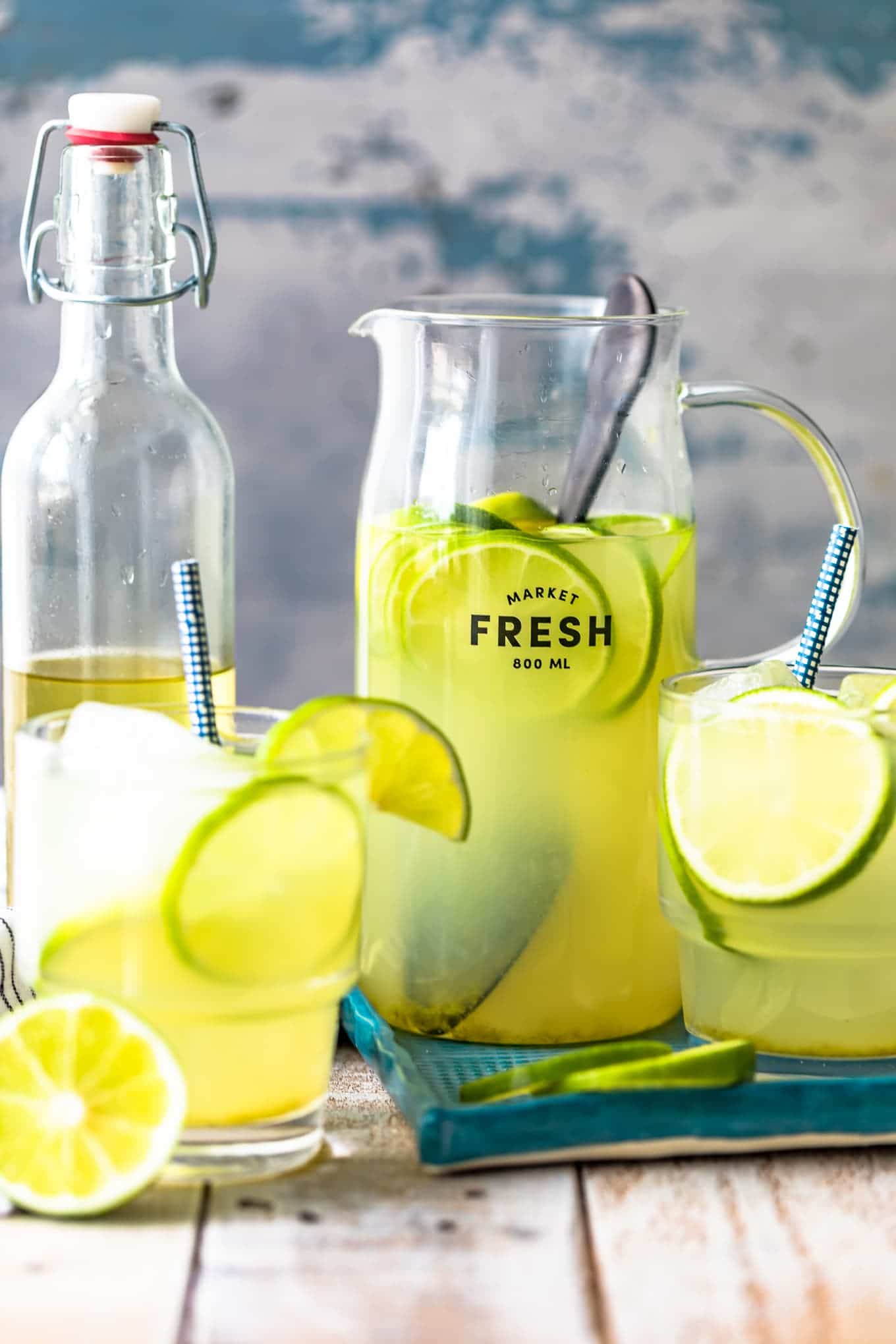 a pitcher and two glasses of limeade