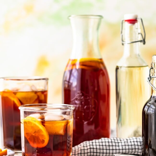 A homemade pitcher of sweet iced tea adorned with lemon slices.