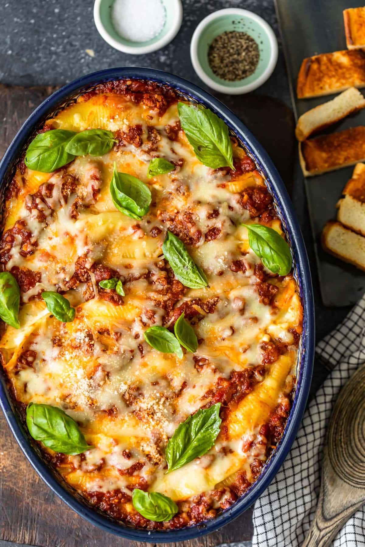 pasta shells in a blue baking dish