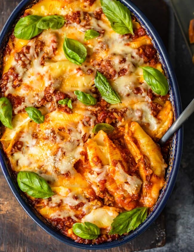 italian stuffed shells in a dish with spoon