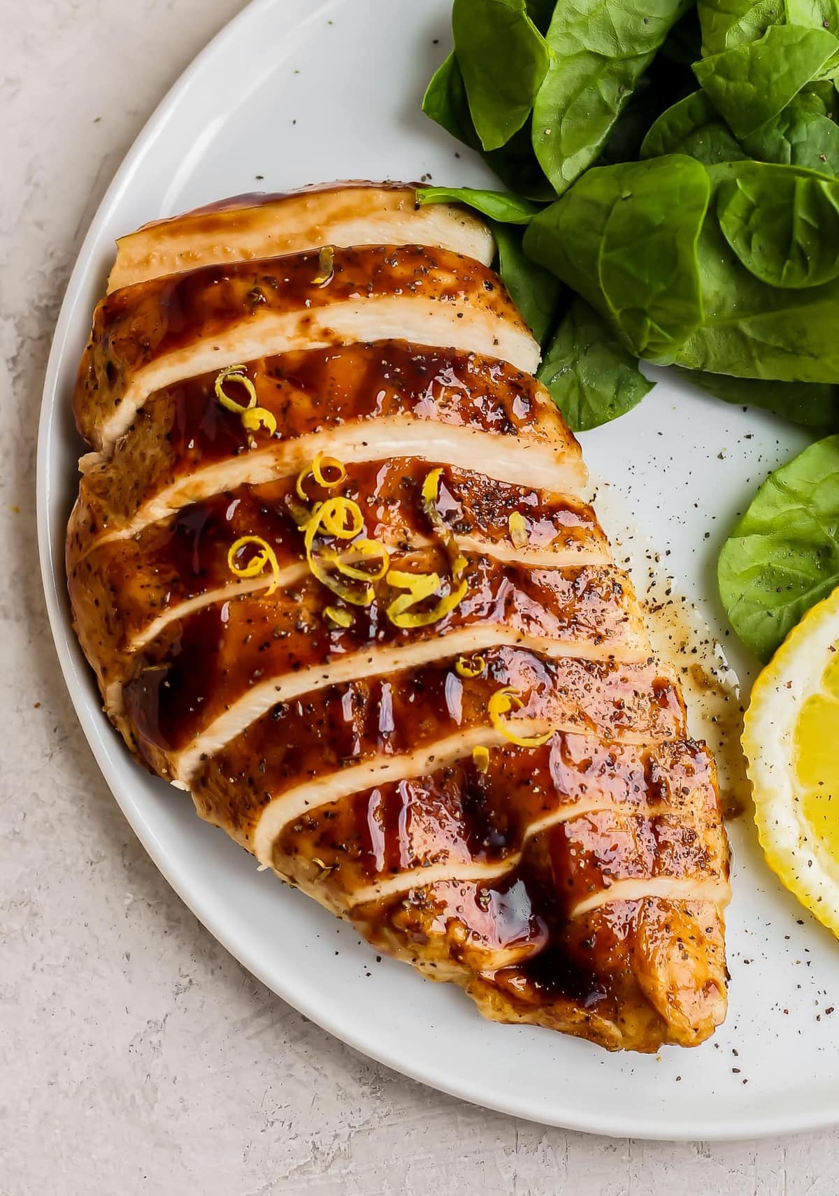 baked chicken breast sliced on a plate