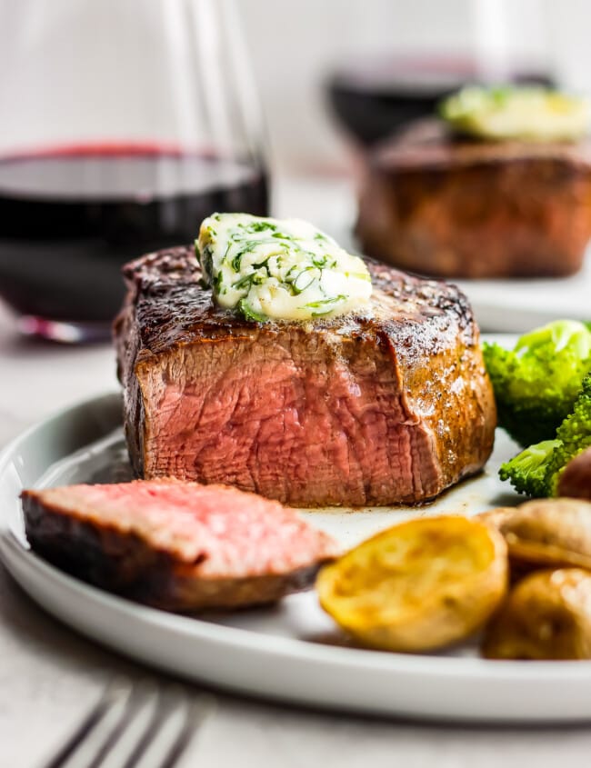 sliced steak with cilantro steak butter on top