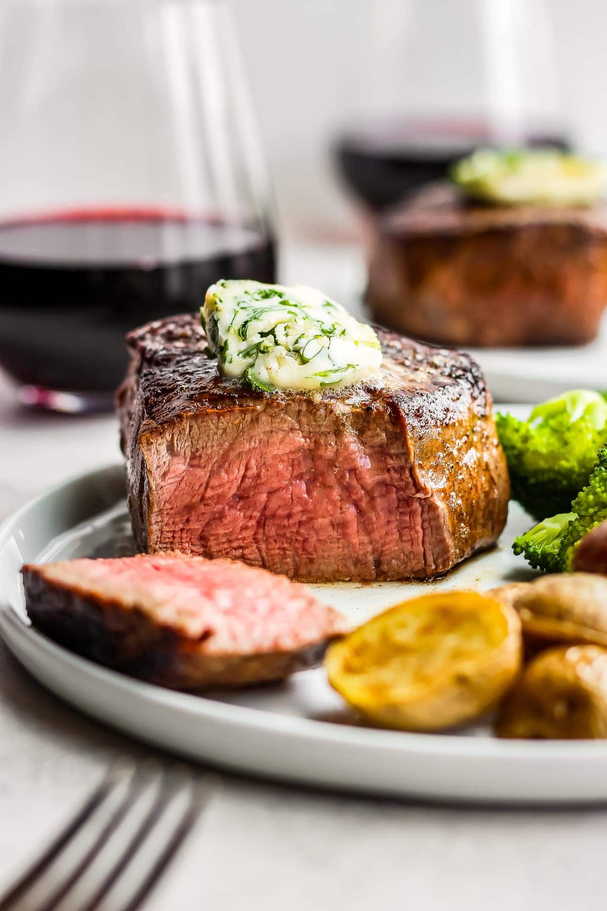 steak on a plate topped with butter