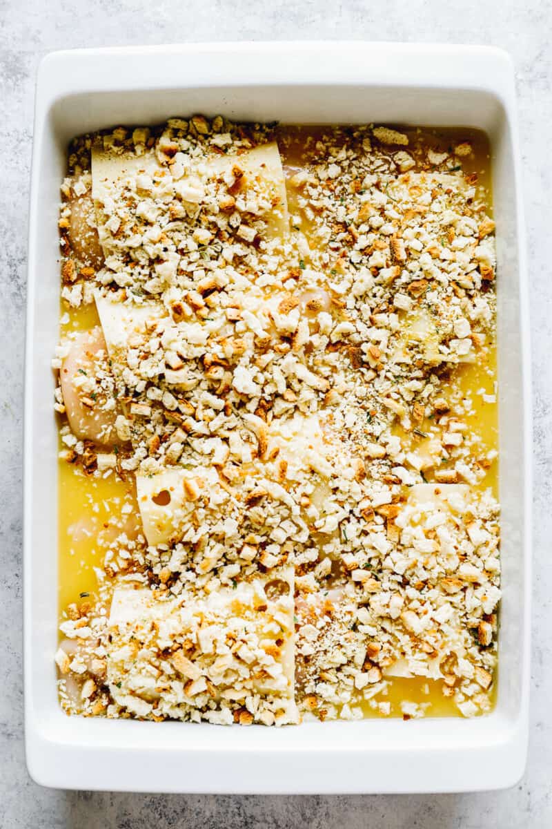 swiss chicken bake before baking with stuffing mix on top