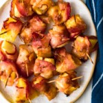 bacon wrapped pineapple on plate
