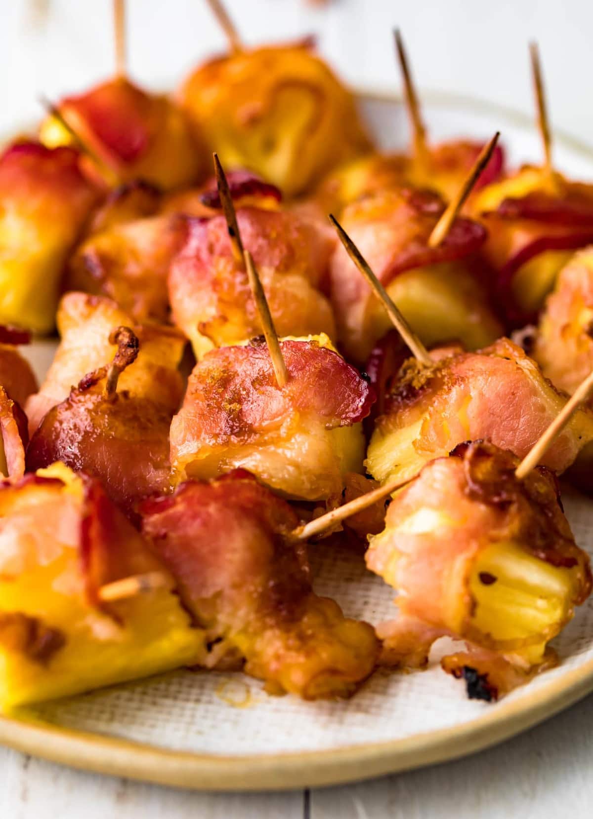 Close up of pineapple chunks wrapped in bacon