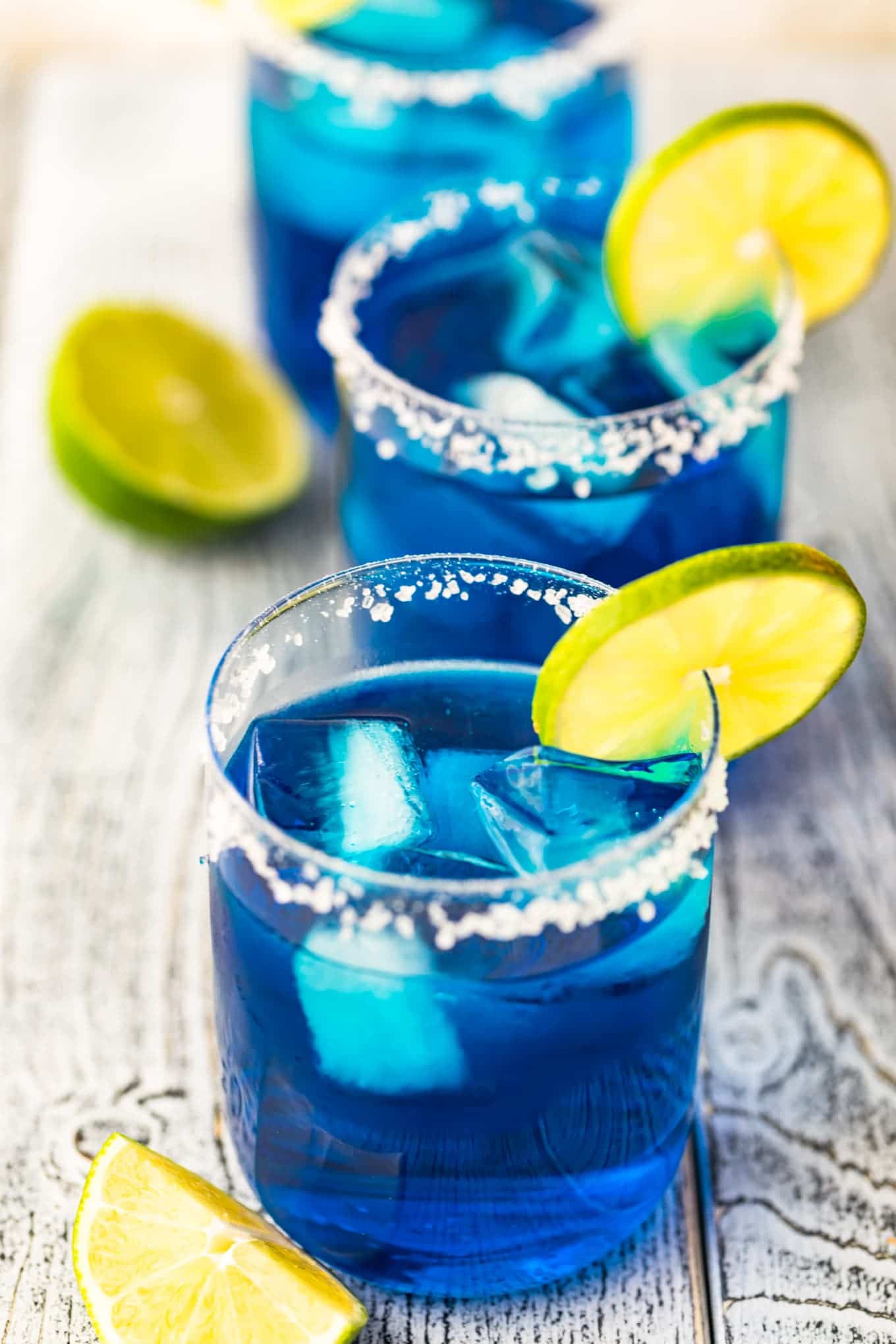 Top shot of three blue margarita cocktails