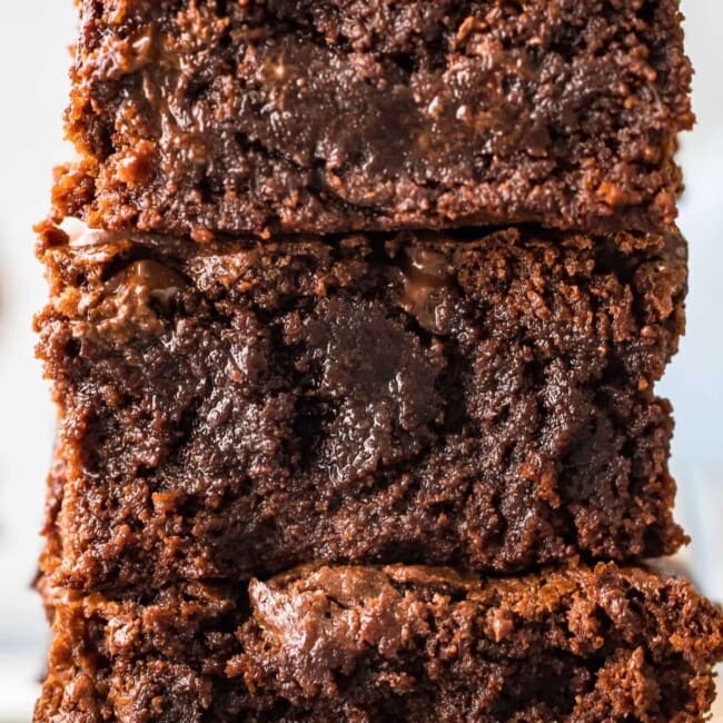 A stack of gluten-free brownies stacked on top of each other.