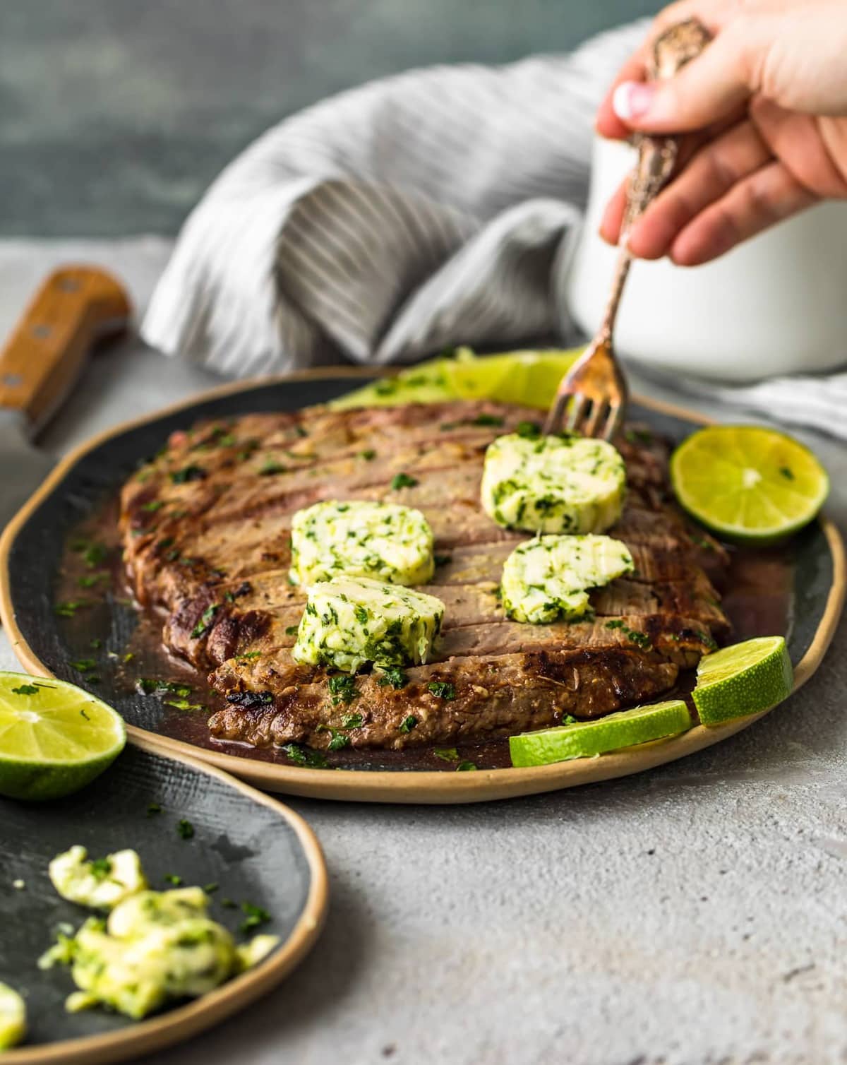 grilled flank steak topped with cilantro lime butter