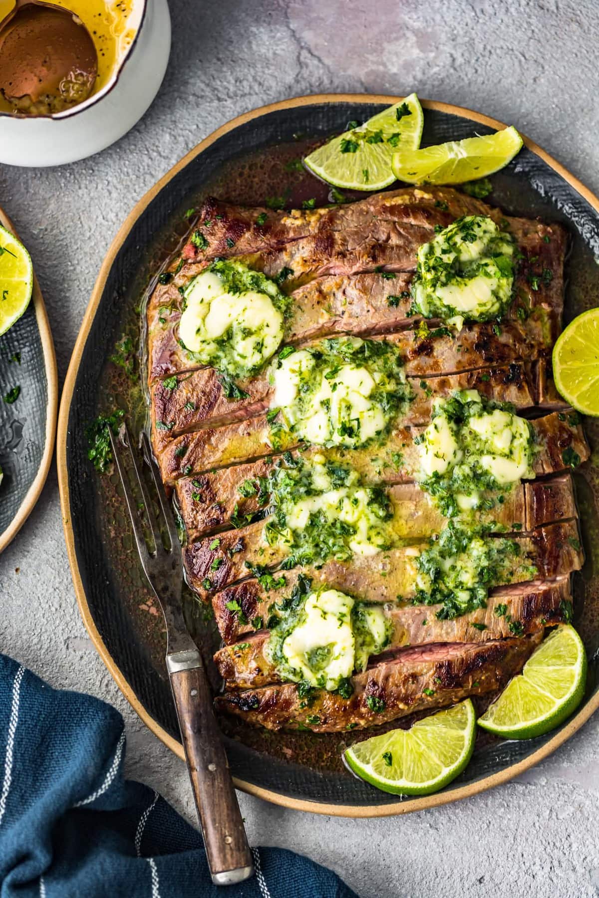 plate of grilled steak sliced into thin strips