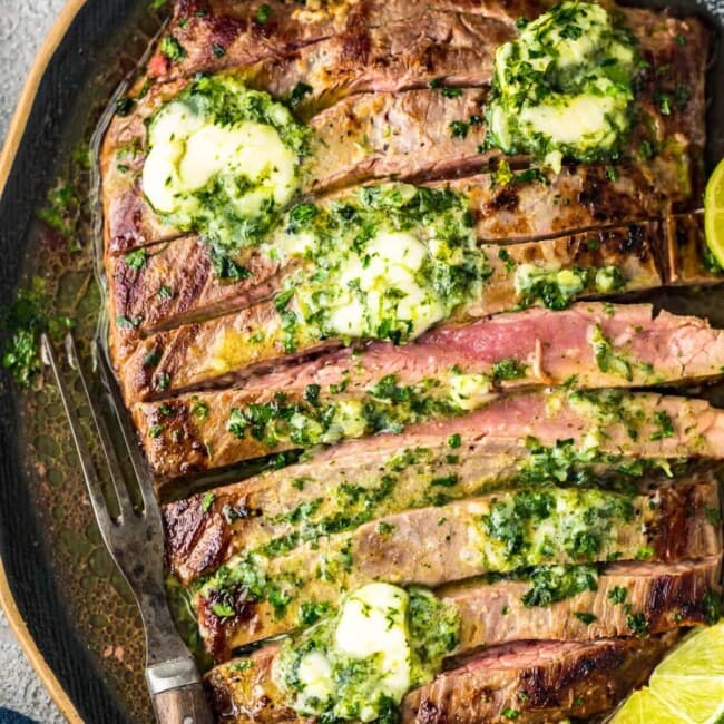 grilled flank steak with cilantro lie butter on top