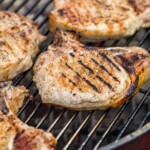 grilled pork chops on the grill