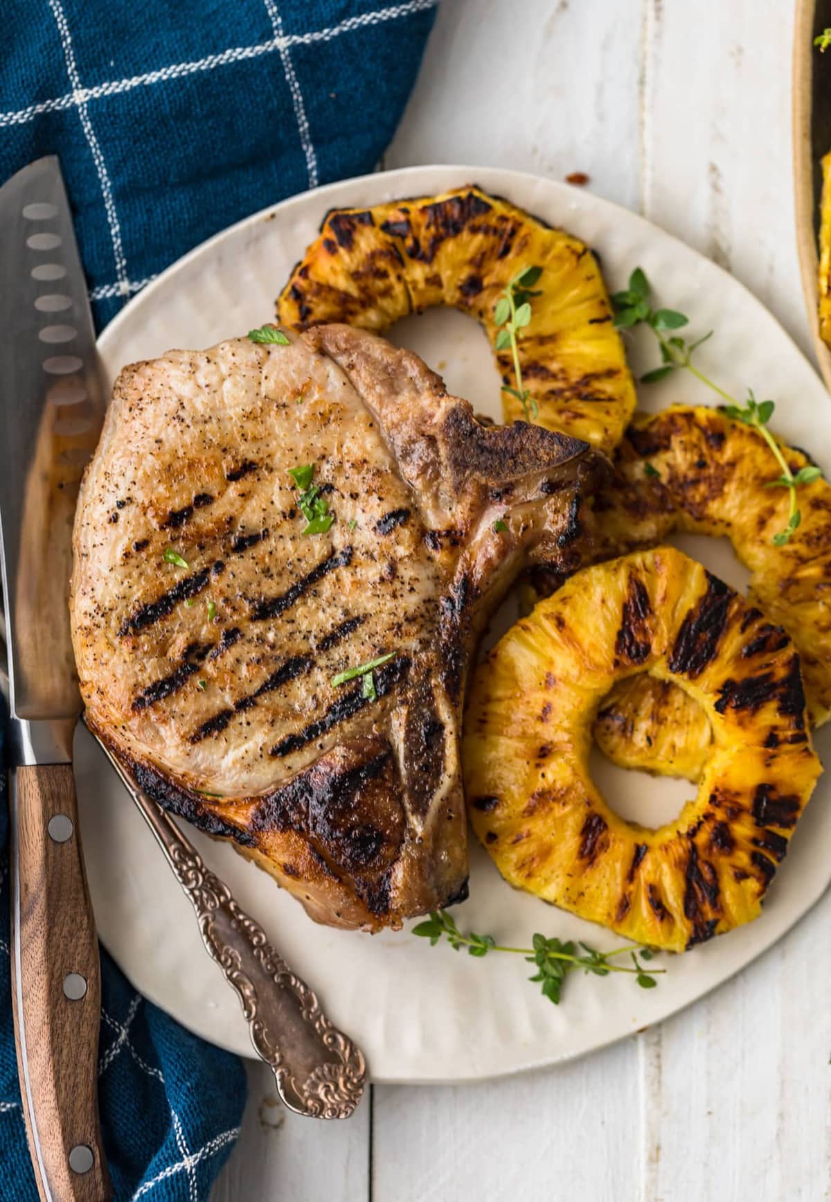 chops and pineapple served on a plate