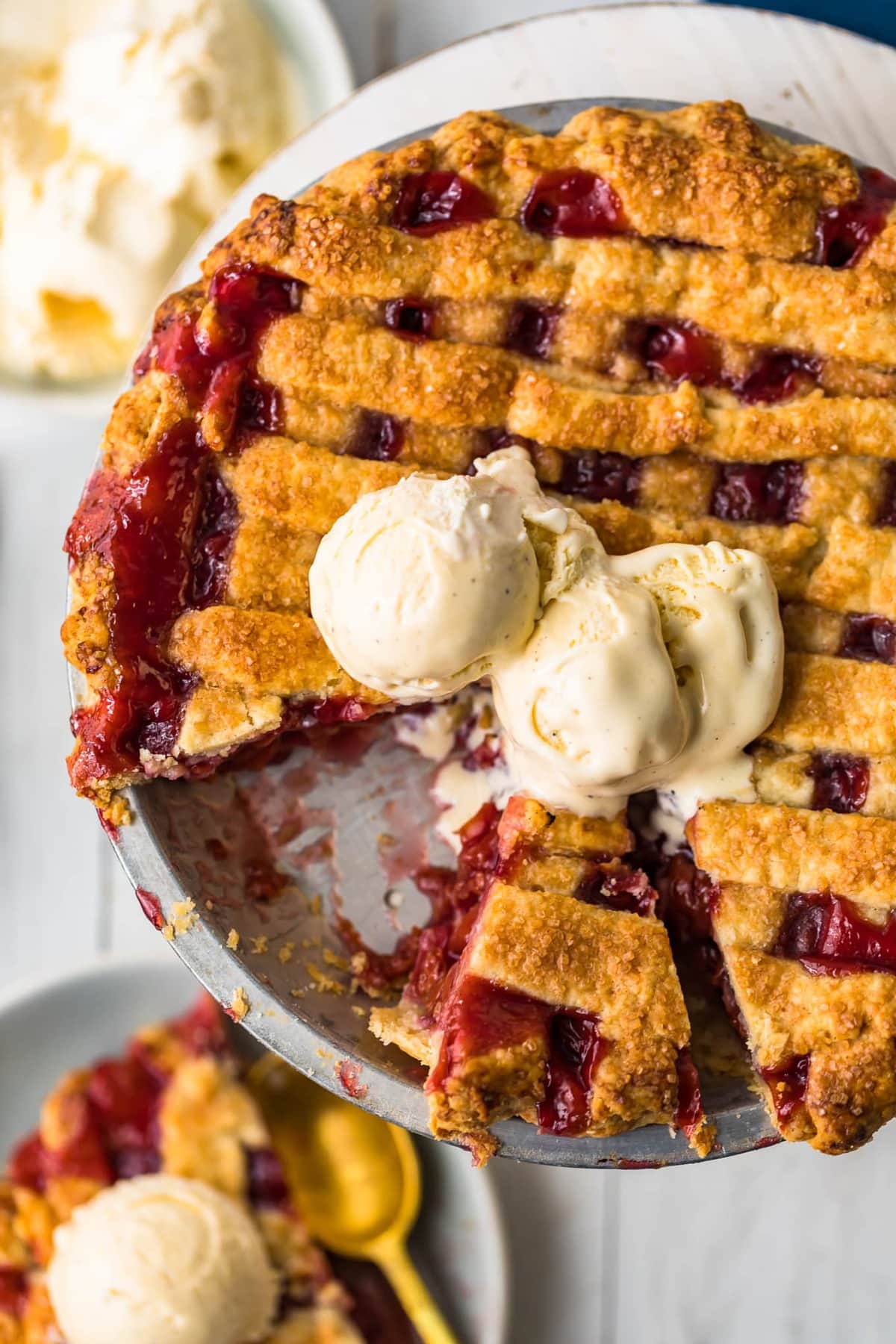 A homemade cherry pie with two scoops of ice cream