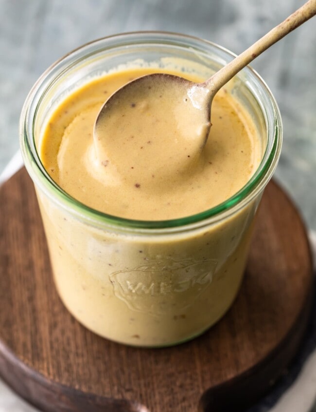 mustard cream sauce in a mason jar with spoon