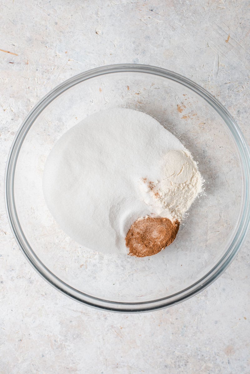 It wouldn't be Fall without a Homemade Pumpkin Pie and this pie is without a doubt the best I've ever tasted and is super easy to whip up! #pumpkinpie #dessert Sugar, flour and cinnamon in a bowl, ready to be transformed into Pumpkin Pie.