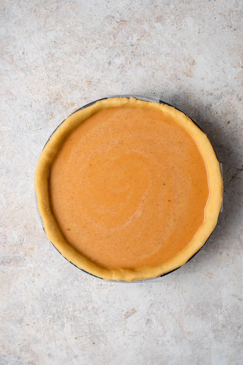 It wouldn't be Fall without a Homemade Pumpkin Pie and this pie is without a doubt the best I've ever tasted and is super easy to whip up! #pumpkinpie #dessert An overhead shot of homemade pumpkin pie ready for the oven