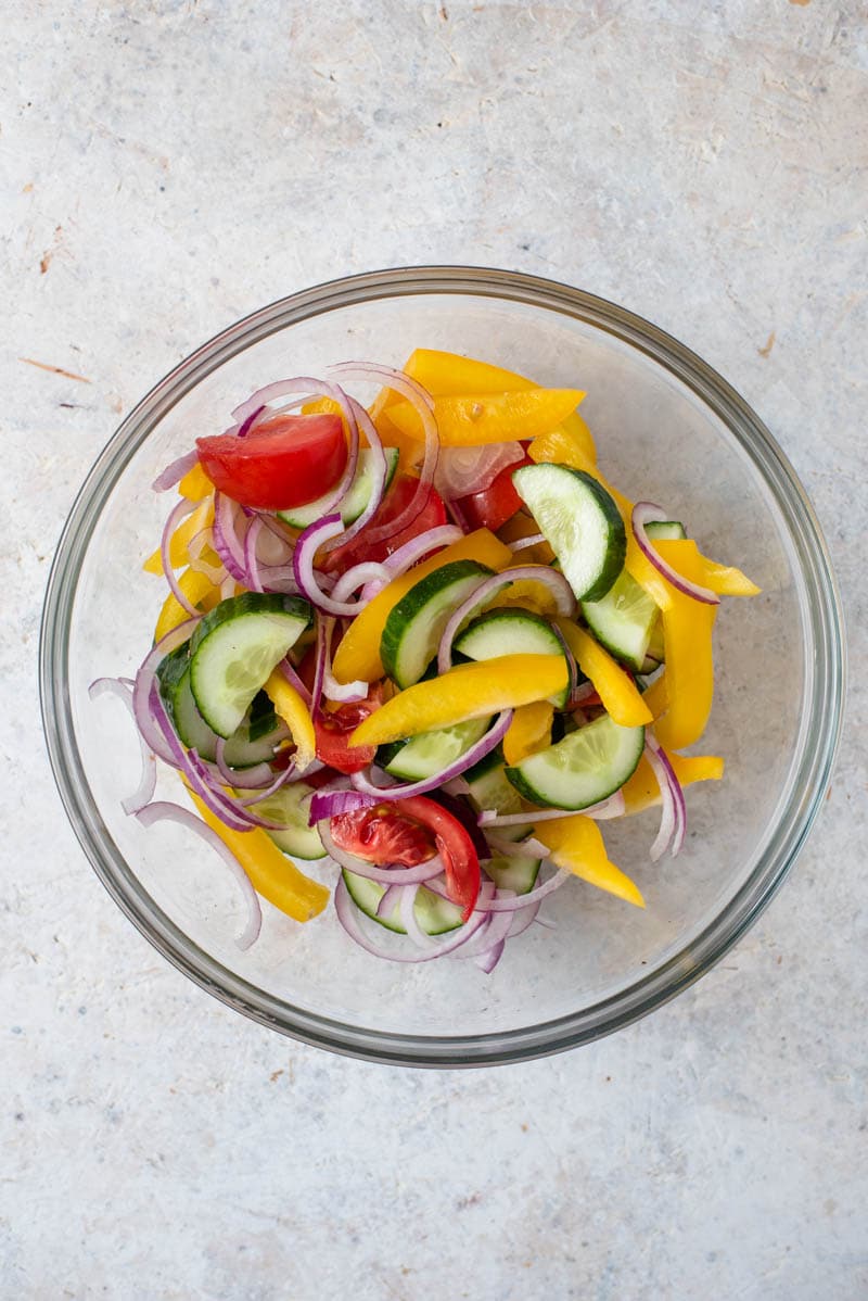 Vegetables in a glass bowl for making panzanella salad