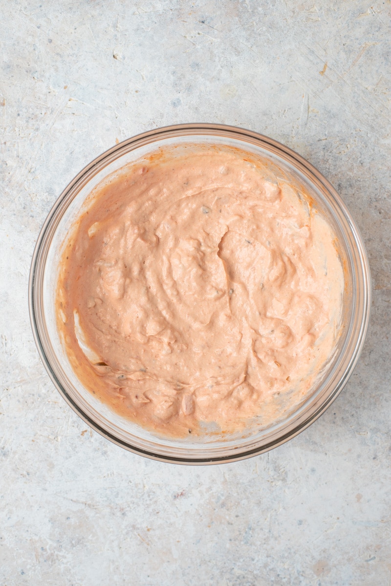 Cream cheese and salsa in a bowl.