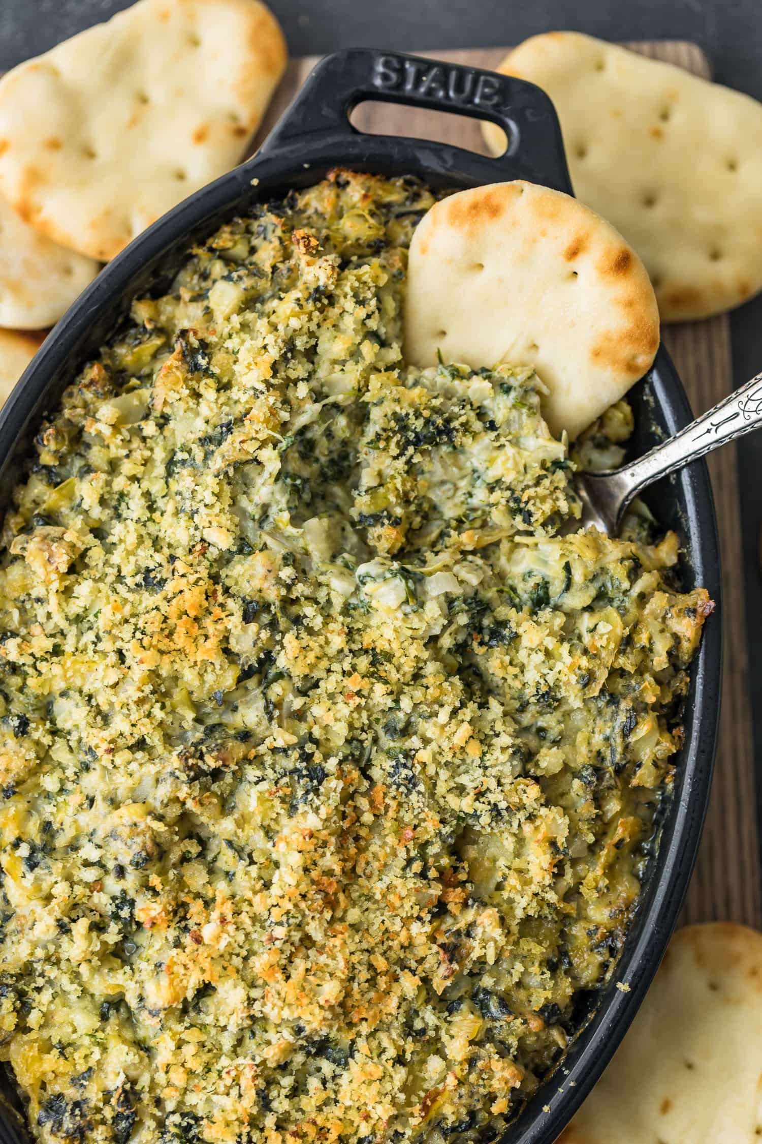 Baked Spinach Artichoke Dip served in a black dish