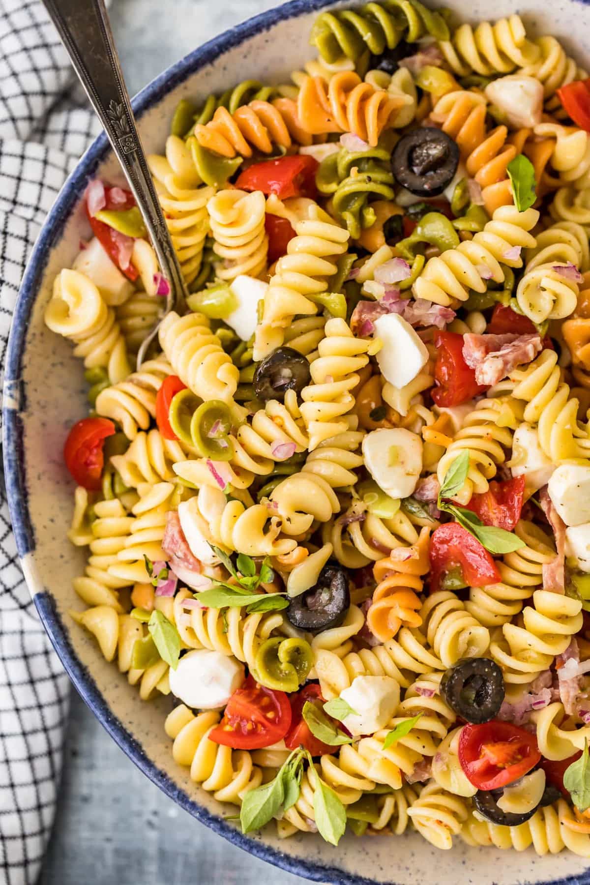 cold pasta salad in a large serving bowl