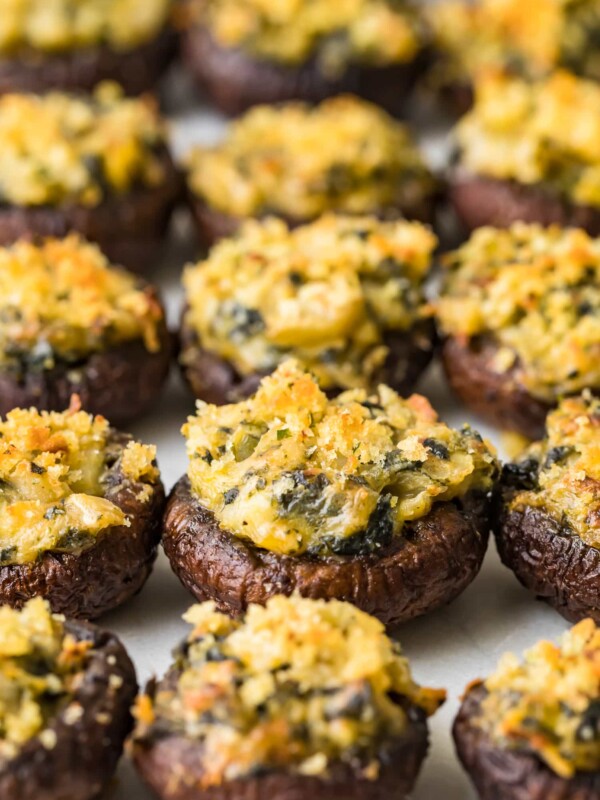 stuffed mushrooms lined up on a sheet