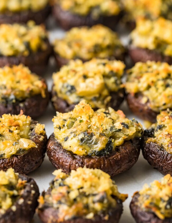 stuffed mushrooms lined up on a sheet