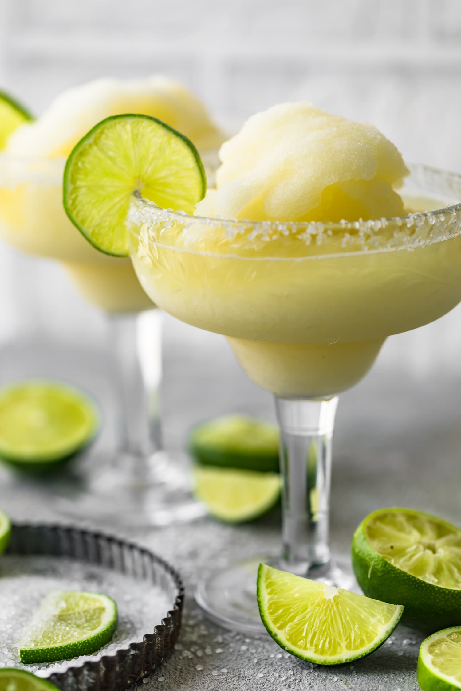 A frozen margarita in a salt rimmed glass