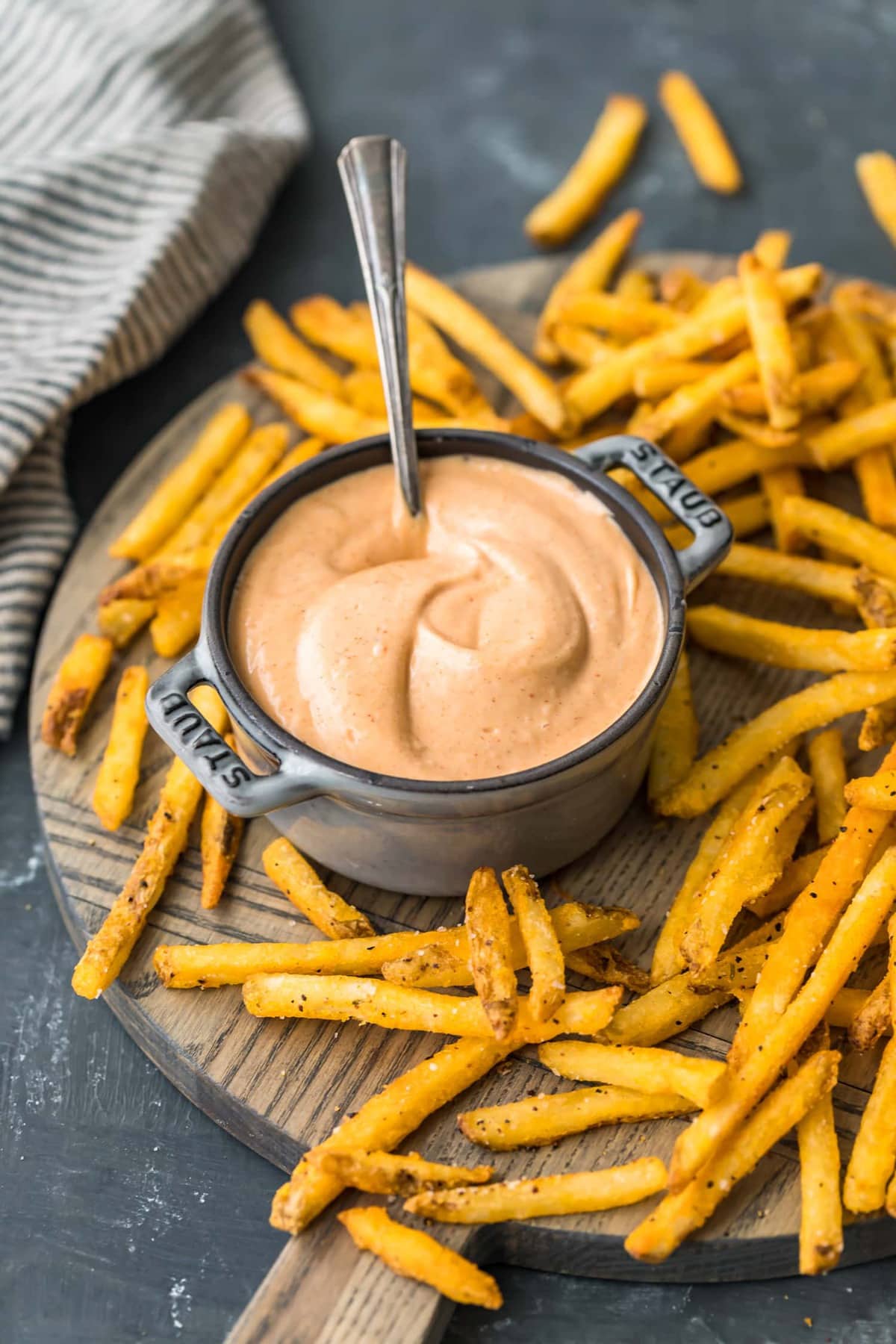 A spoon in a pot of fry sauce