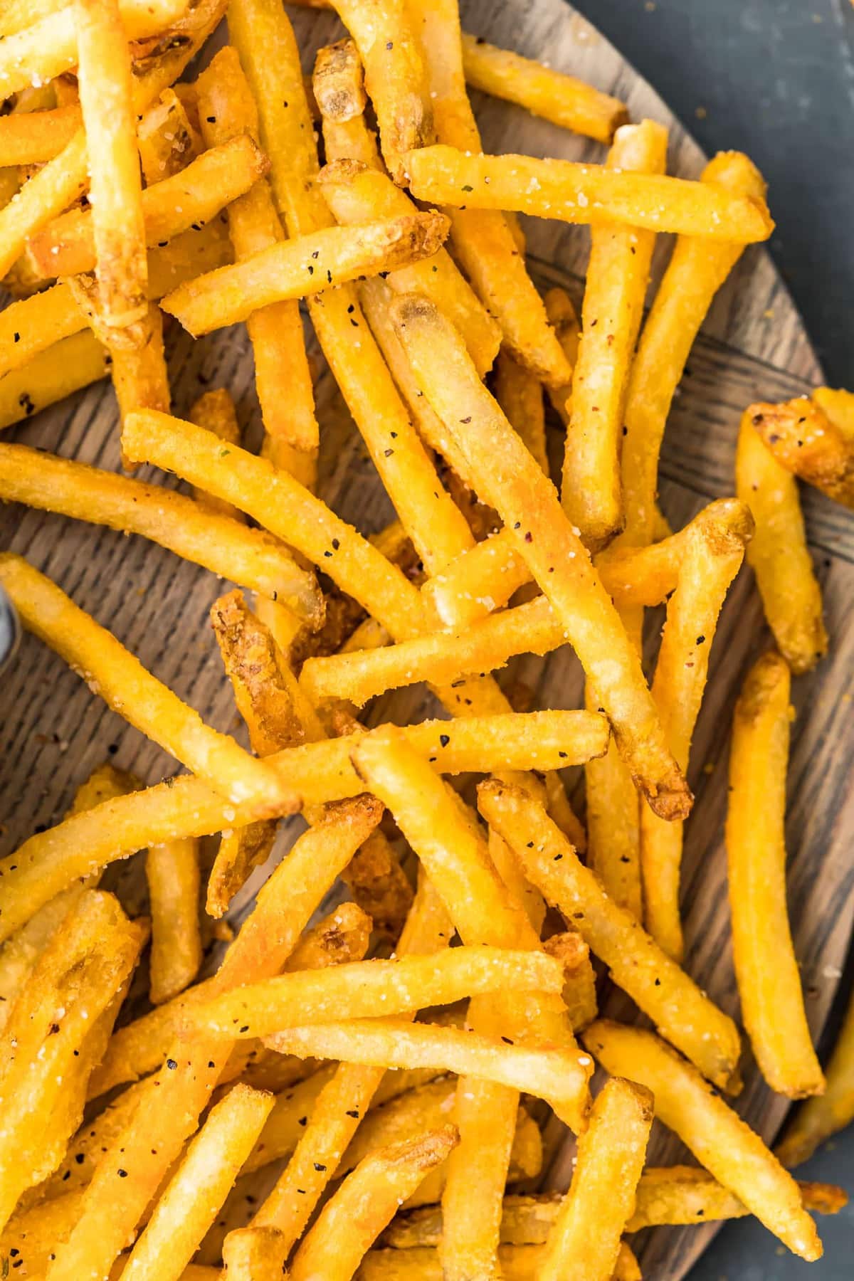 French fries on a wooden board