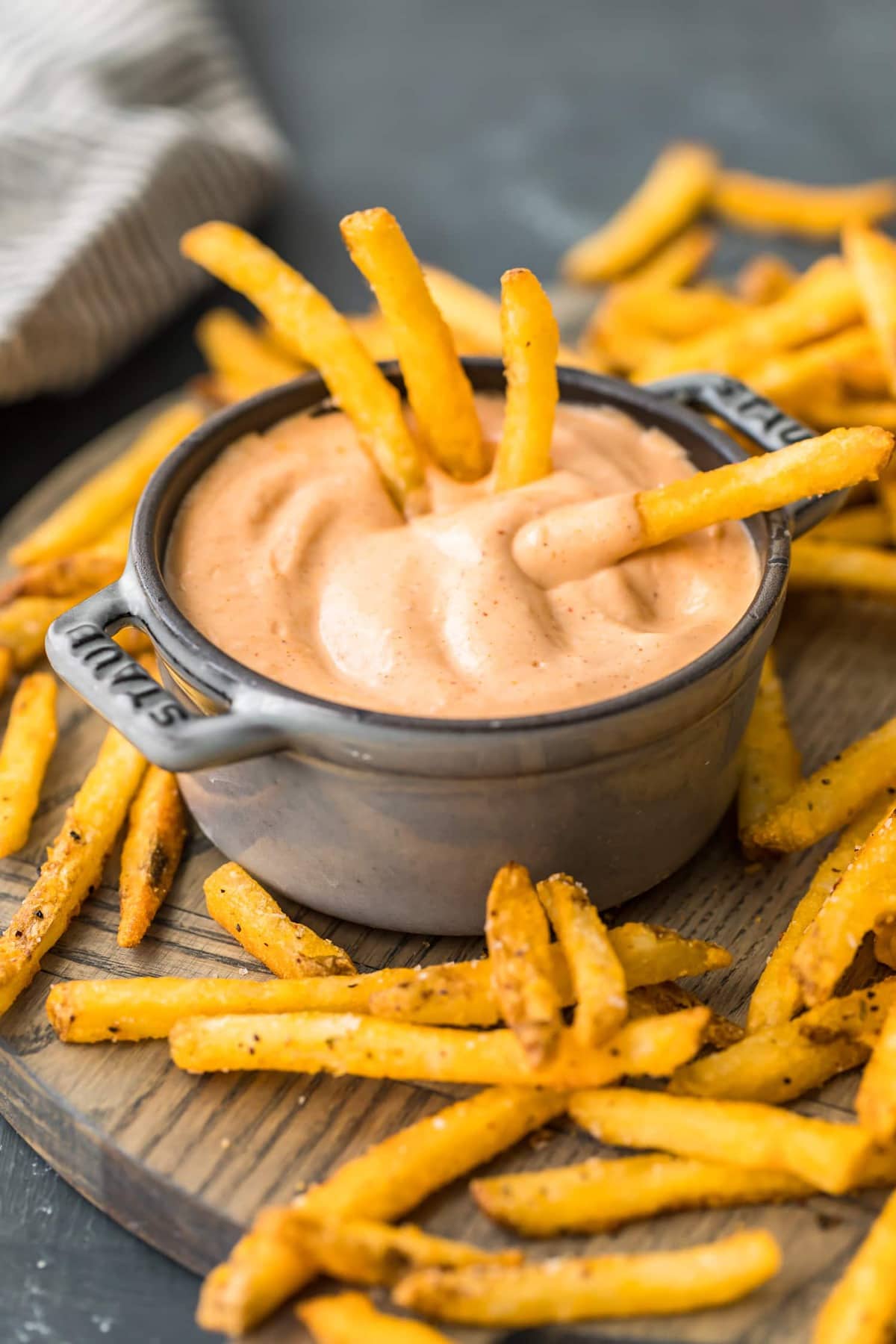 fries and dip on a wooden board