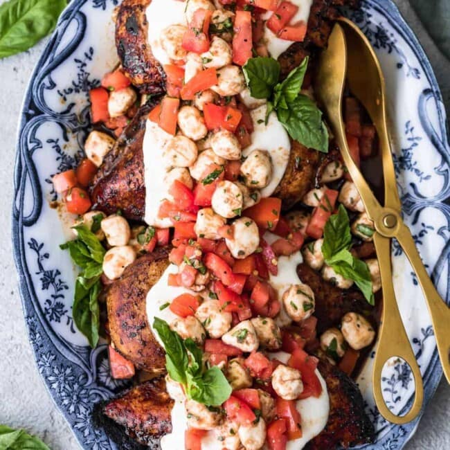 grilled caprese bruschetta chicken on a plate