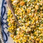 grilled corn salad in a bowl with a spoon